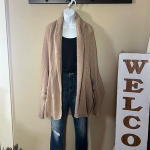 Women’s open front cardigan. Longer mid thigh length. One size fits all.
